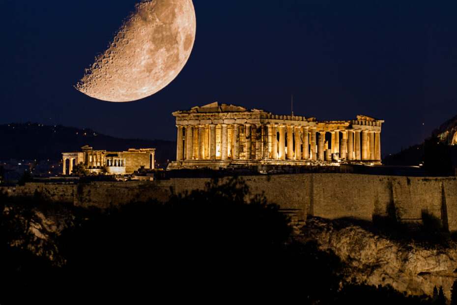 Parthenon of Athens under a huge magnificent moon, at dusk time,  Greece